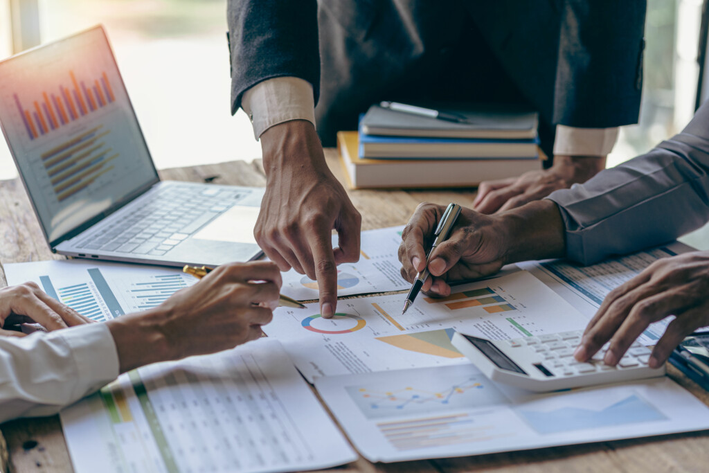 Investment finance concept, group of young businessmen pointing